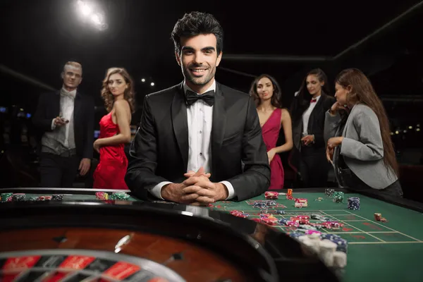 A glamorous woman holding casino chips in a neon-lit environment, representing the premium online casino atmosphere of CAWABANGA.