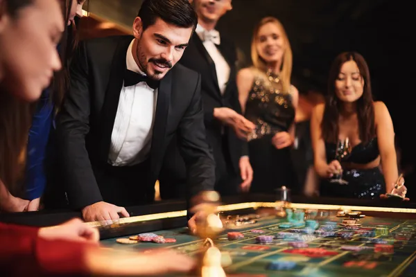 A person using their device against a moody casino-themed background, illustrating the smooth re-entry process at CAWABANGA.